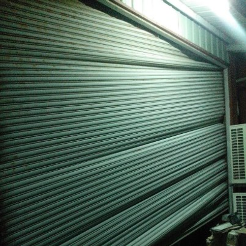 手拉 電動捲門變形修理 換新